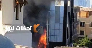صورة لحريق دبي مول في الشيخ زايد مع تصاعد الدخان ورجال الإطفاء في مكان الحادث
